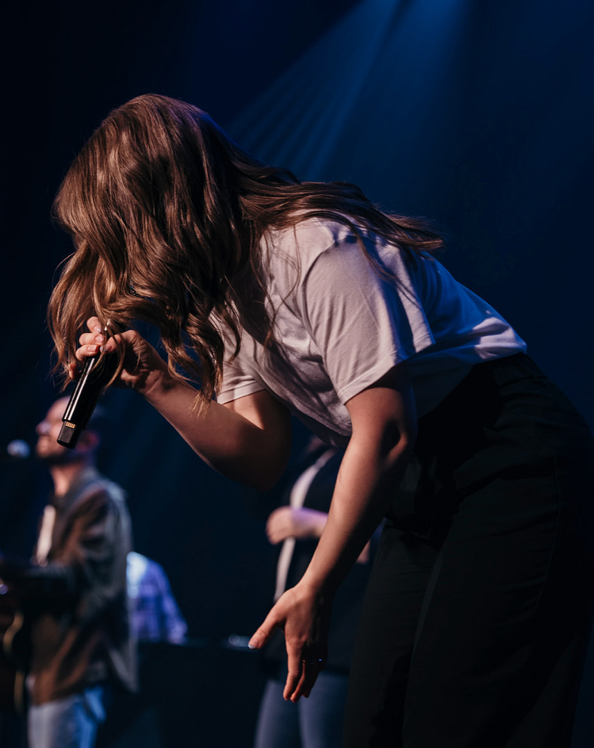 Girl singing in a microphone